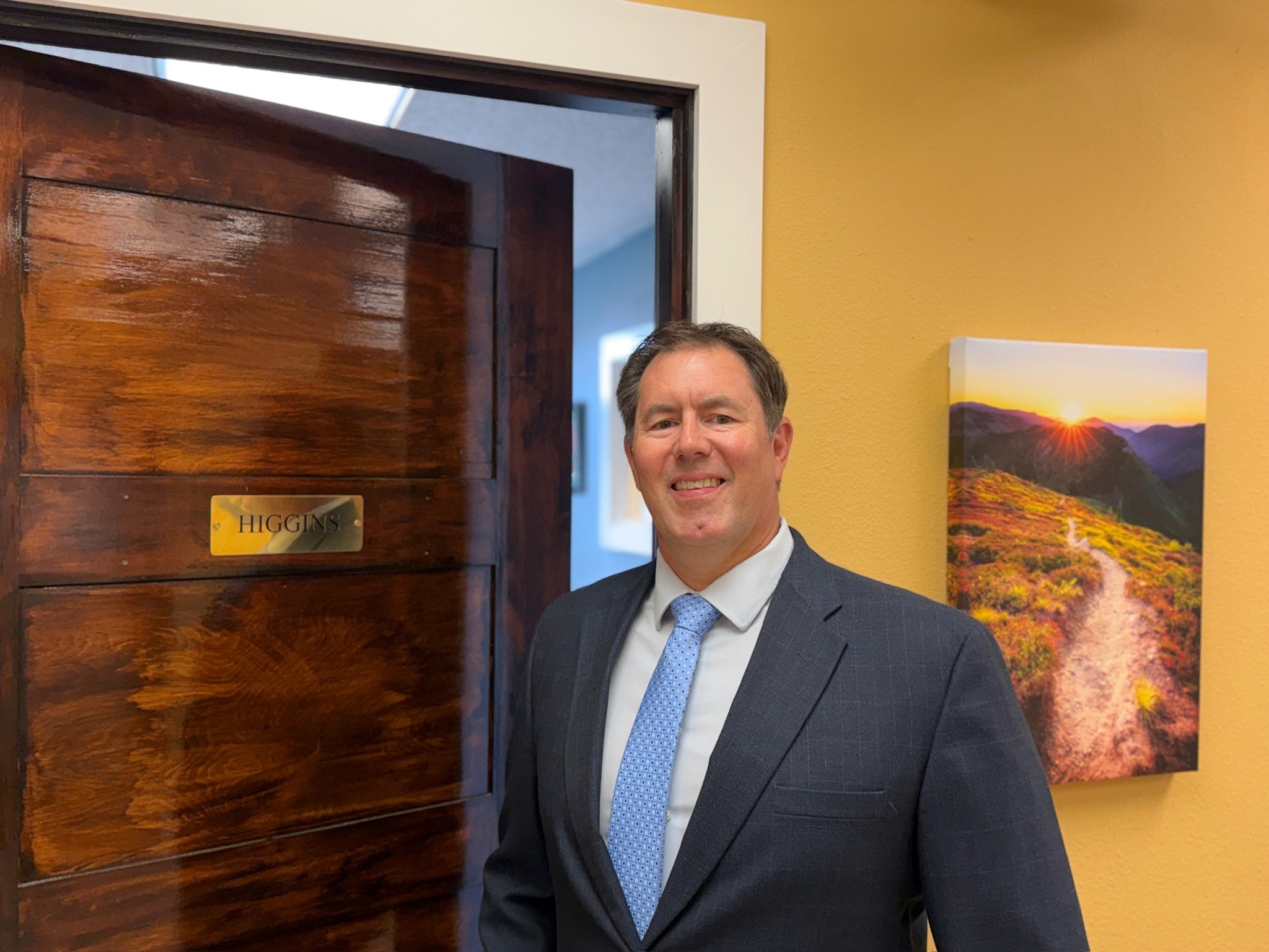 Mitch Vap standing at the entrance to the Higgins conference room in Missoula, Montana